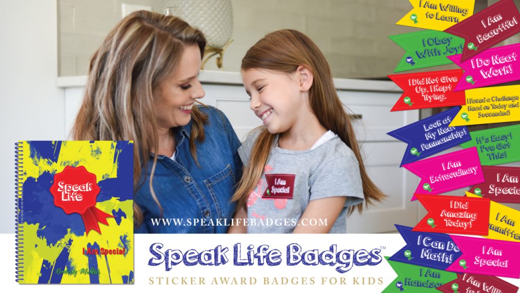 Mom and daughter smiling at each other. Daughter is wearing a Speak Life Badge for kids that reads I am Special. positive encouragement for children in sticker award badges positive parenting tool